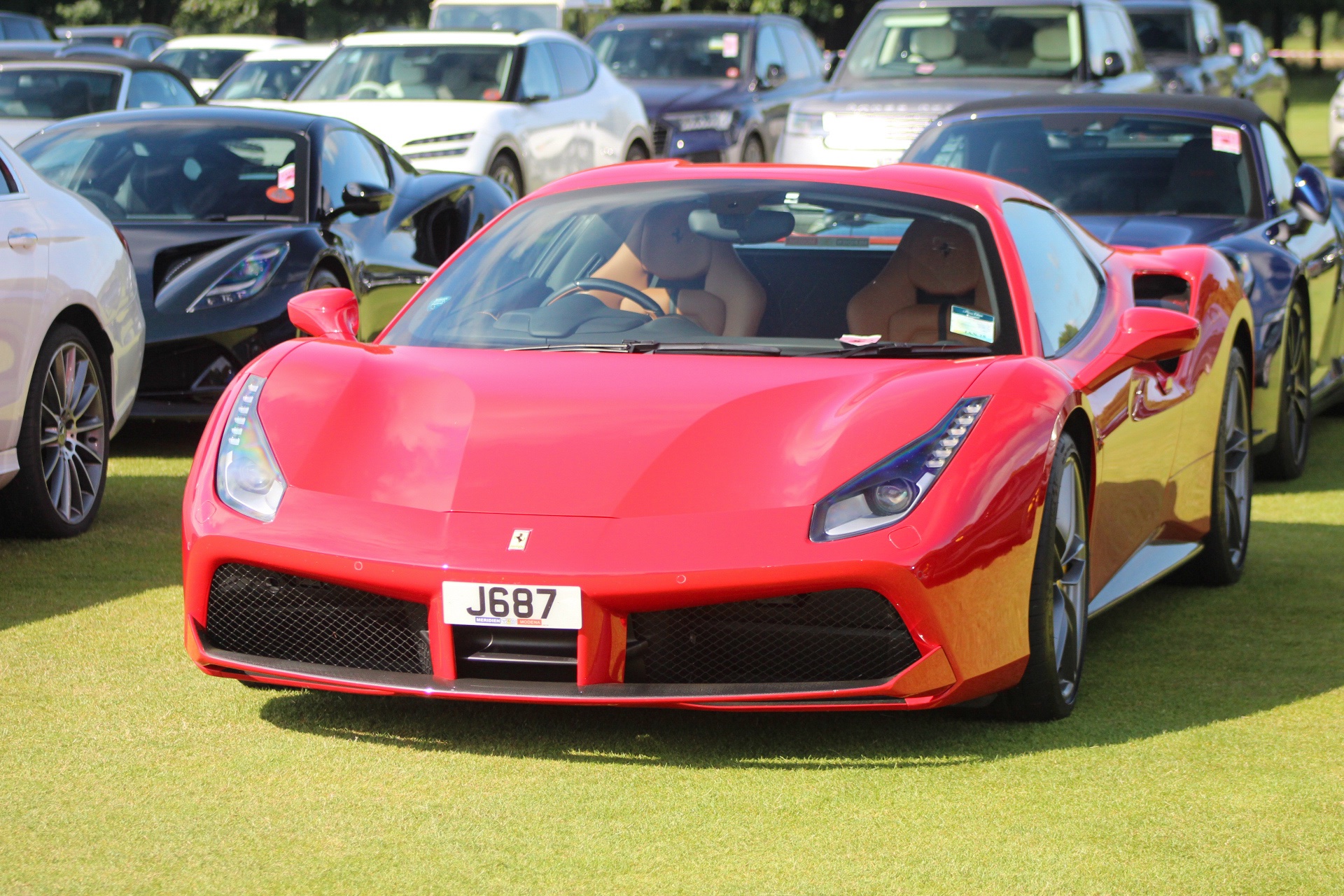 J 687 private number plate on a Ferrari 488, spotted in Goodwood House