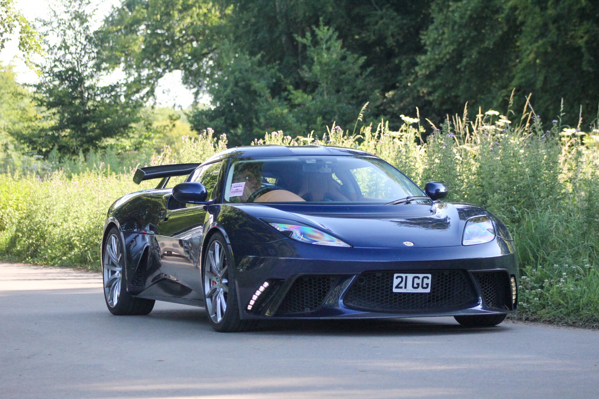 21 GG private number plate on a Lotus Evora, spotted in Goodwood House