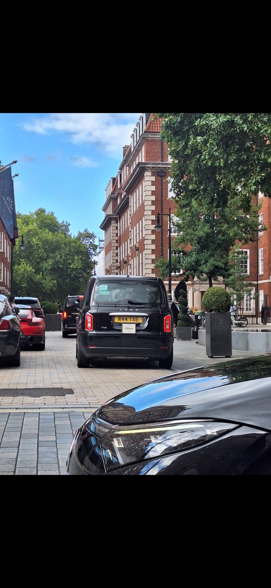 R44 TXE private number plate on a LEVC, spotted in London