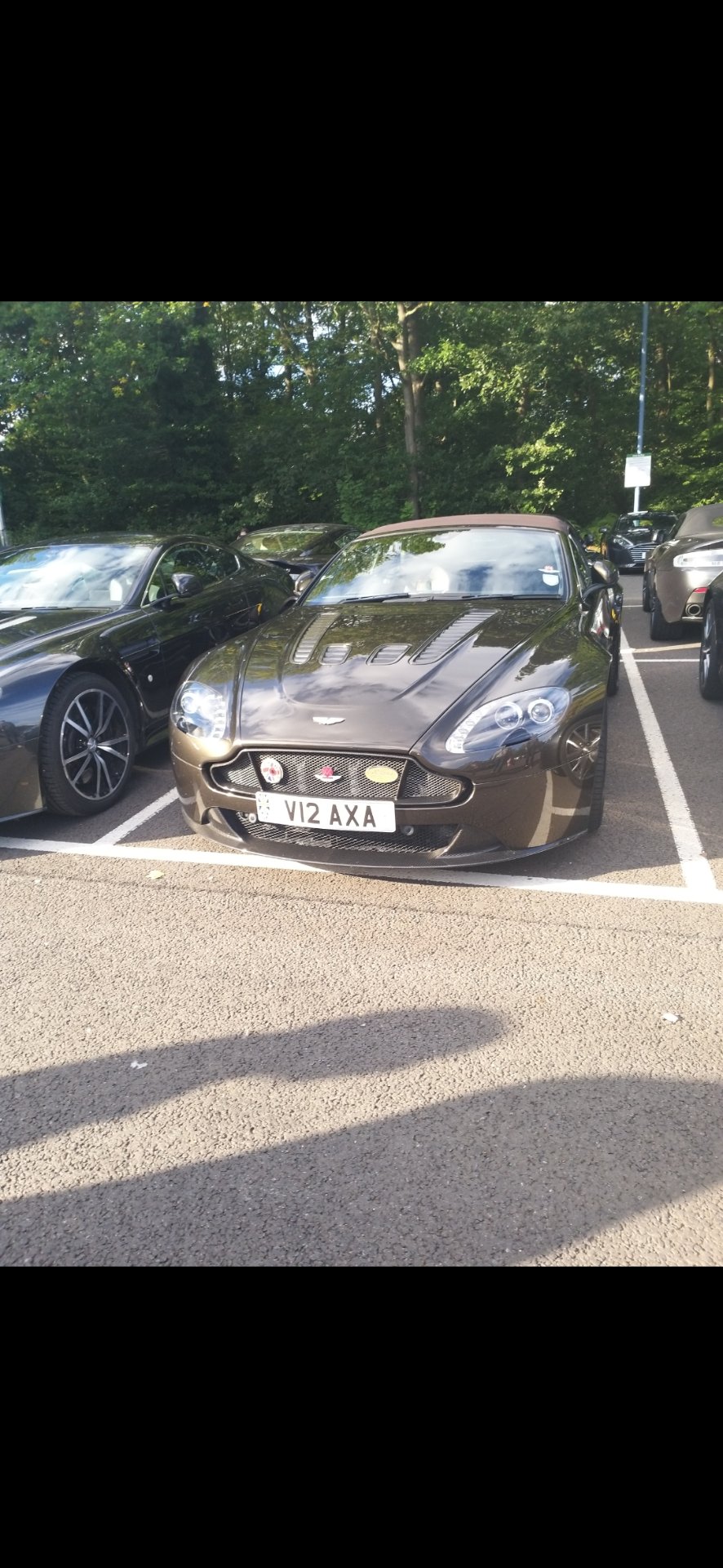 V12 AXA private number plate on a Aston Martin V12 Vantage, spotted in Welwyn Garden City