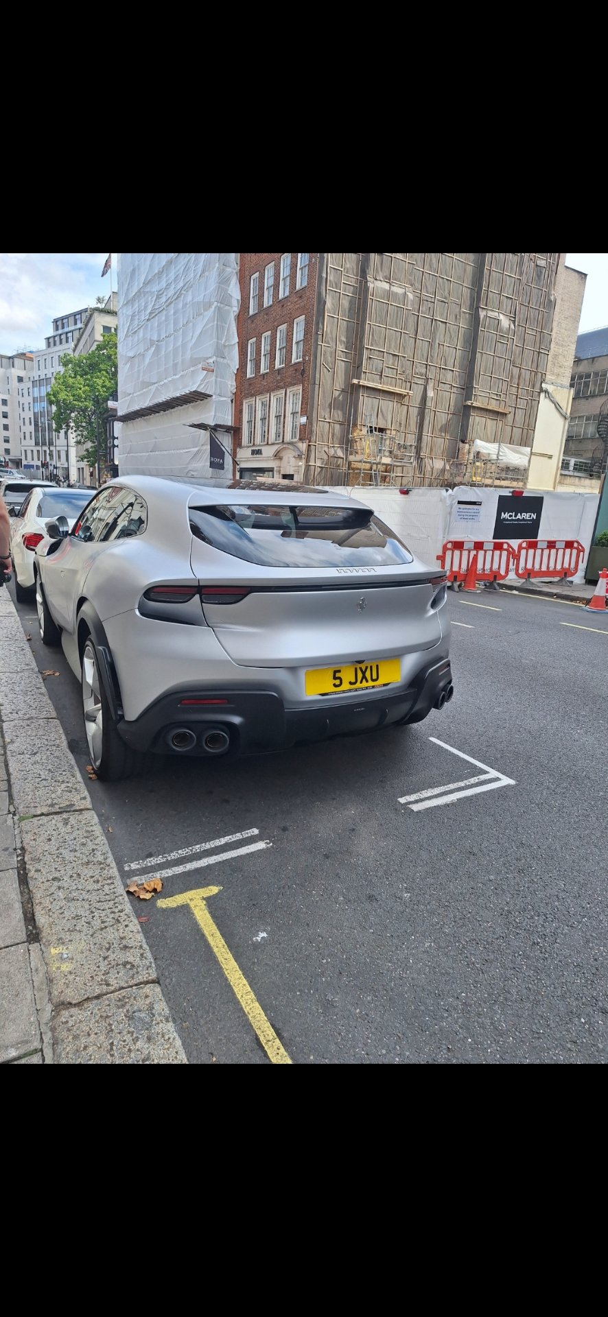 5 JXU private number plate on a Ferrari Purosangue, spotted in London
