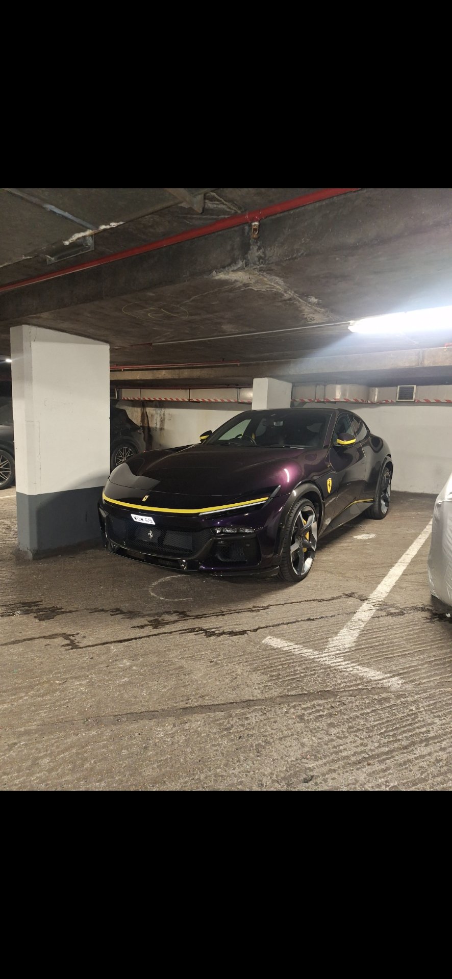 WOW 69 private number plate on a Ferrari Purosangue, spotted in London