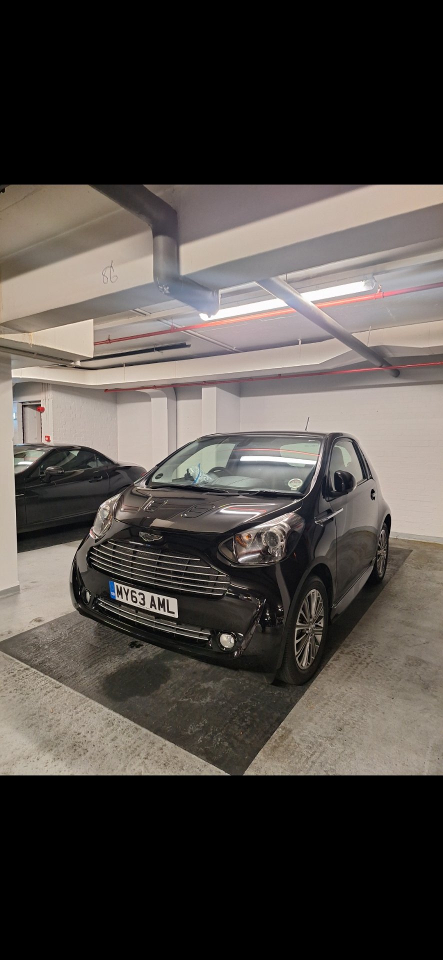 MY63 AML private number plate on a Aston Martin Cygnet, spotted in London