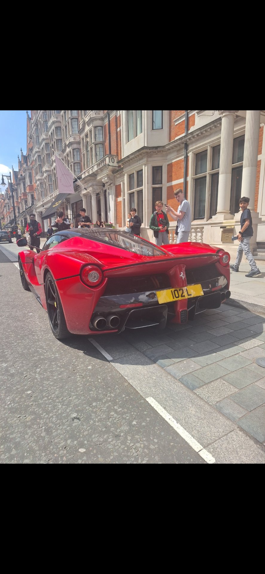 102 L private number plate on a Ferrari, spotted in London
