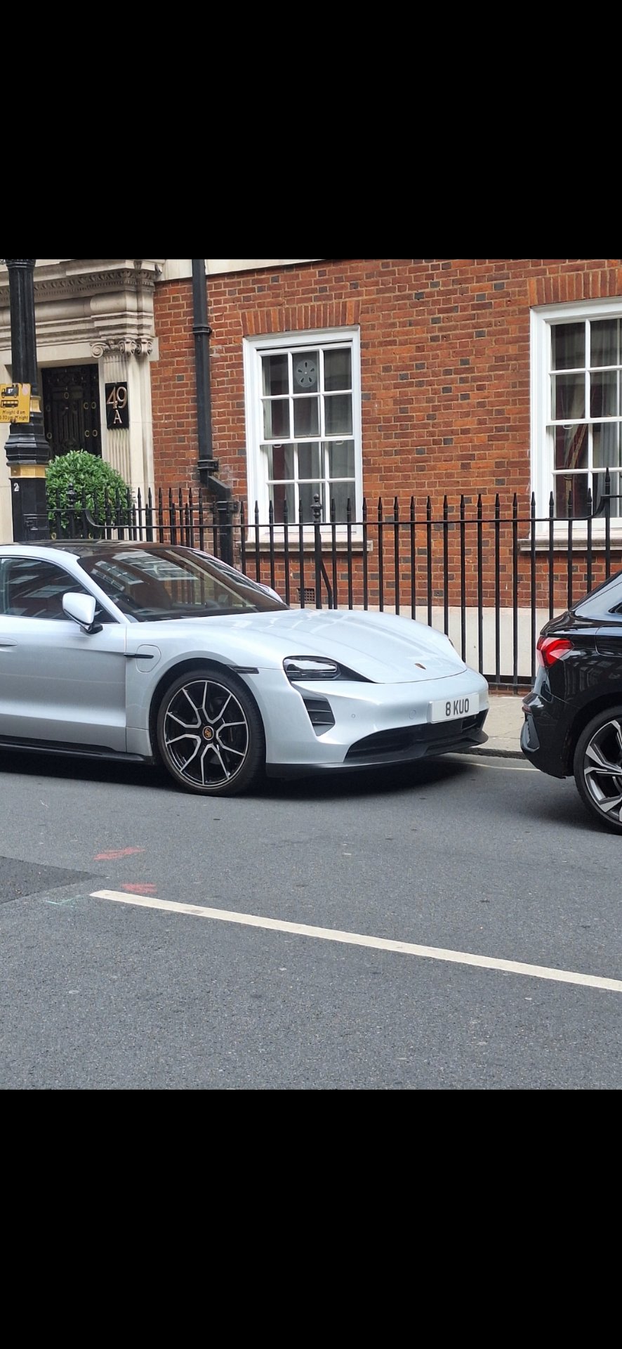8 KUO private number plate on a Porsche Taycan, spotted in London