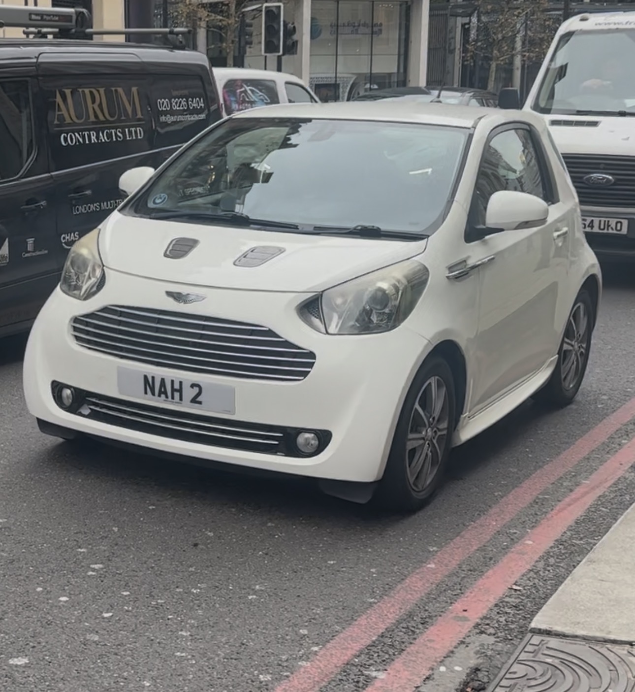 NAH 2 private number plate on a Aston Martin Cygnet, spotted in London