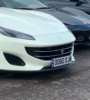 OO60 DJW private number plate on a Ferrari
