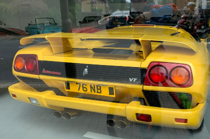 76 NB private number plate on a Lamborghini Diablo