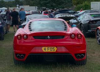 4 FOS private number plate on a Ferrari