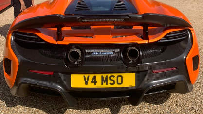 V4 MSO private number plate on a McLaren