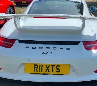 R11 XTS private number plate on a Porsche