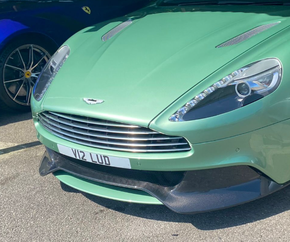 V12 LUD private number plate on a Aston Martin Vanquish, spotted in Goodwood Motor Circuit