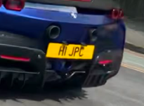 H1 JPC private number plate on a Ferrari