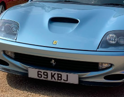 69 KBJ private number plate on a Ferrari